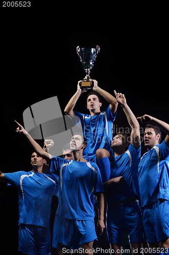 Image of soccer players celebrating victory