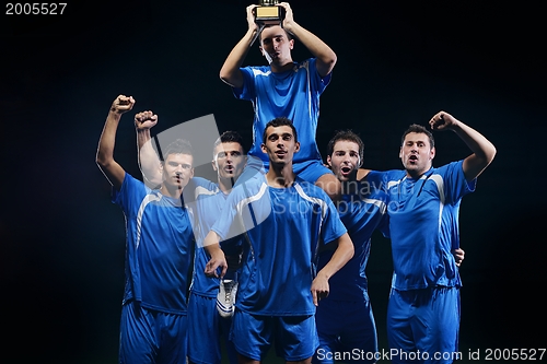 Image of soccer players celebrating victory