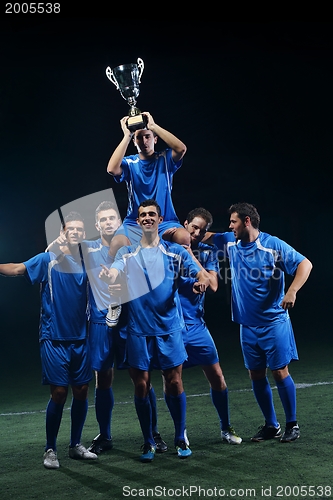 Image of soccer players celebrating victory