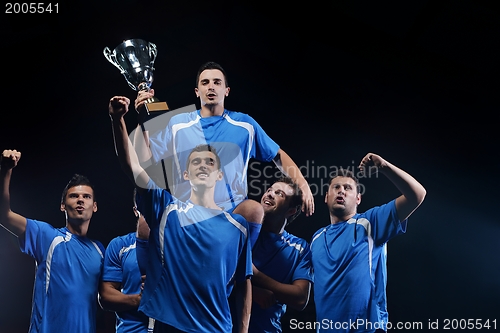 Image of soccer players celebrating victory