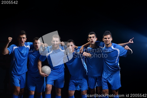 Image of soccer players celebrating victory