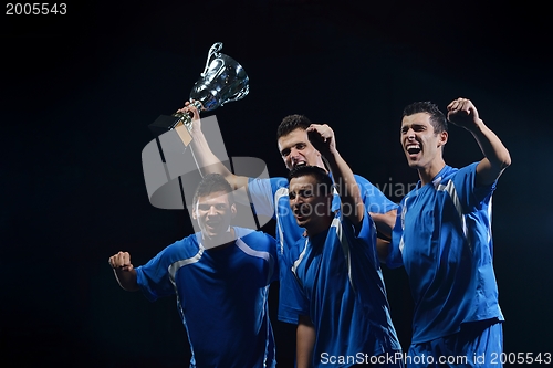 Image of soccer players celebrating victory