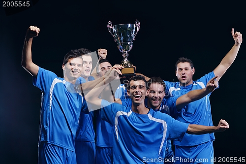 Image of soccer players celebrating victory