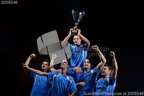 Image of soccer players celebrating victory