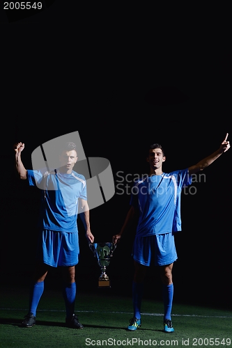 Image of soccer players celebrating victory