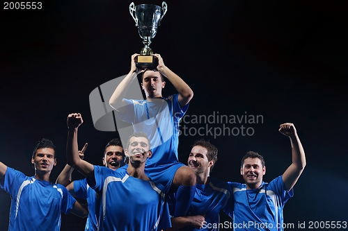 Image of soccer players celebrating victory