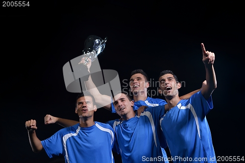 Image of soccer players celebrating victory