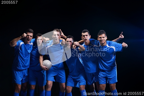 Image of soccer players celebrating victory