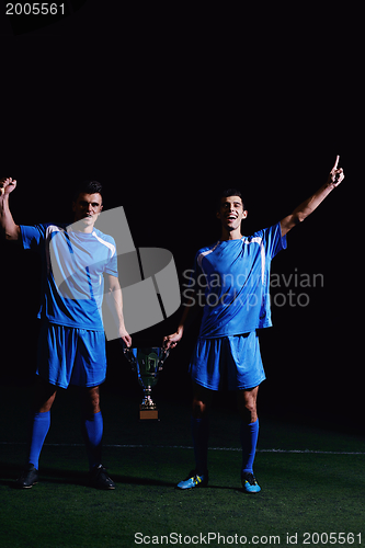 Image of soccer players celebrating victory