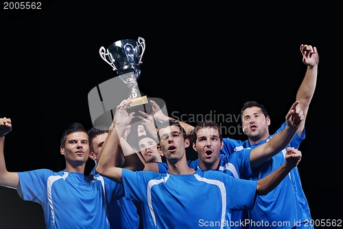 Image of soccer players celebrating victory
