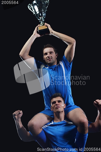 Image of soccer players celebrating victory