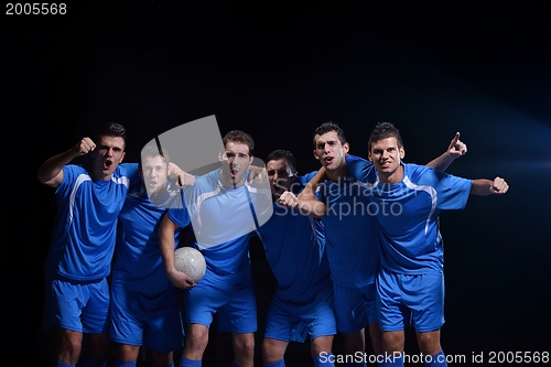 Image of soccer players celebrating victory