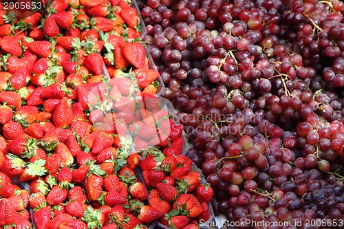 Image of strawberries and red grapes background