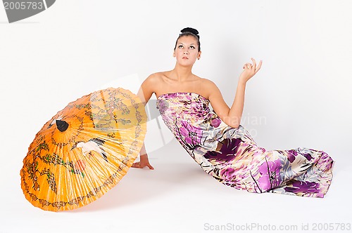 Image of Attractive girl with umbrella
