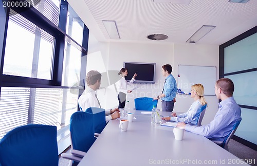Image of business people in a meeting at office