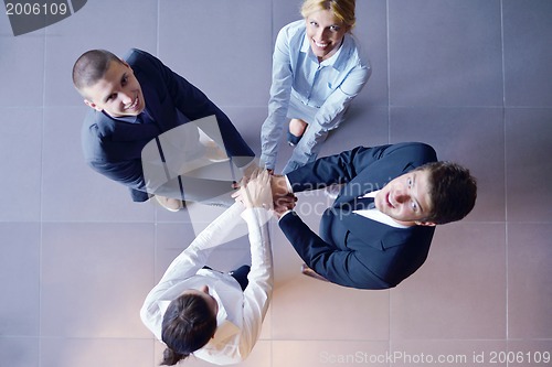 Image of business people group joining hands