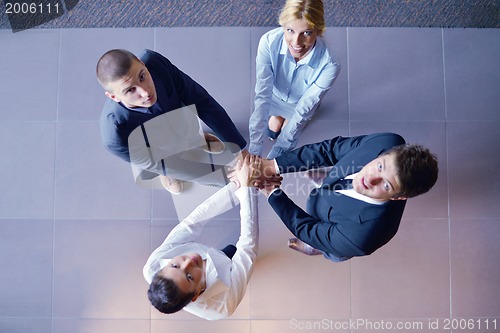 Image of business people group joining hands