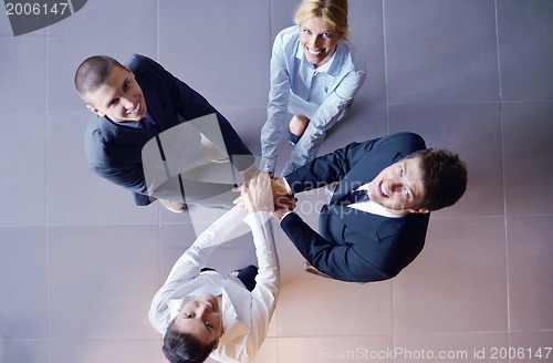 Image of business people group joining hands