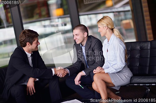 Image of business people making deal