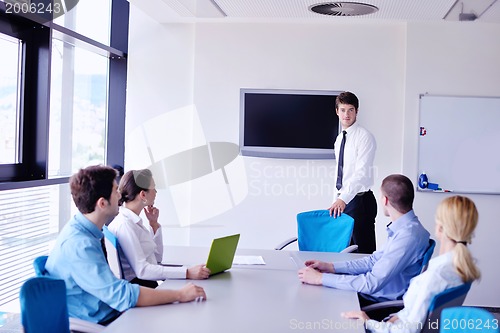 Image of business people in a meeting at office