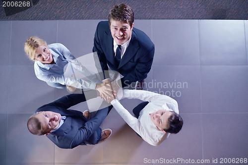 Image of business people group joining hands