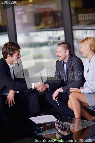 Image of business people making deal