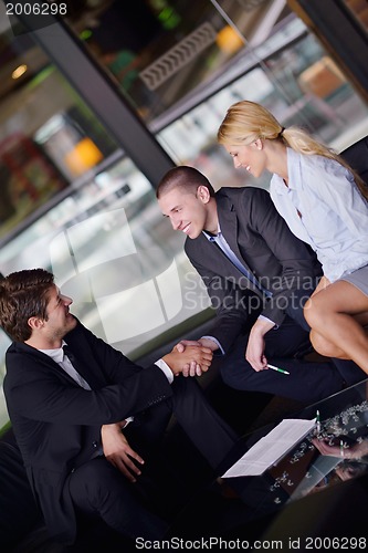 Image of business people making deal