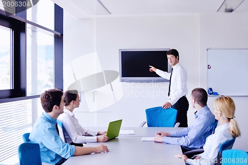 Image of business people in a meeting at office