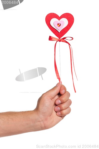 Image of Hand with heart on a stick