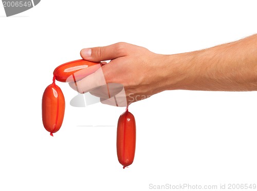 Image of Hand with sausage