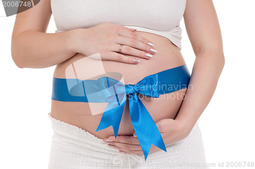 Image of Pregnant belly with blue ribbon