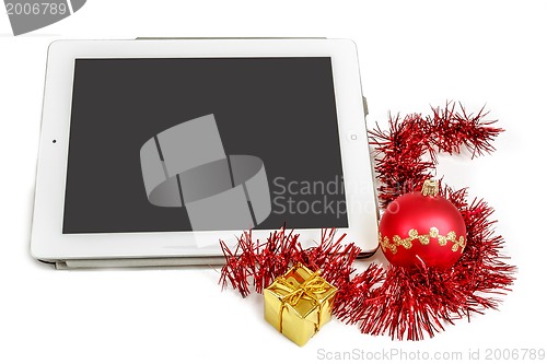 Image of gift white tablet with Christmas ball, box and red chain