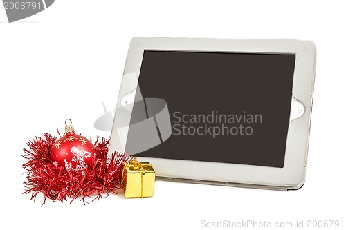 Image of gift white tablet with Christmas ball, box and red chain