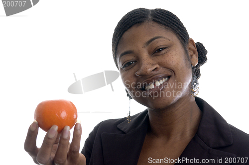 Image of smiling woman with tangerine