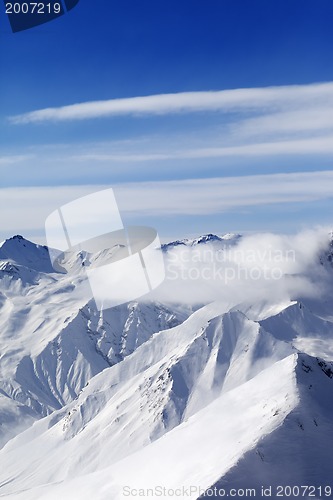 Image of Snow mountains in clouds