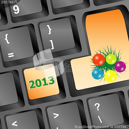 Image of christmas button with balls and fir on keyboard