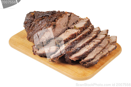 Image of Roast beef on a wooden board