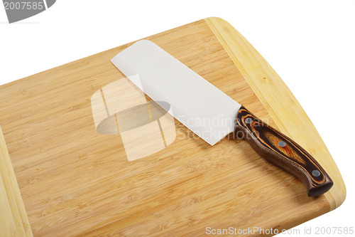 Image of Wooden cutting board with knife