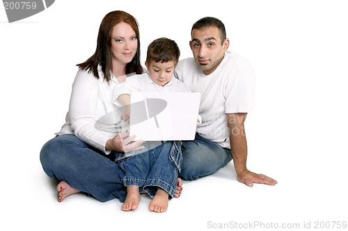 Image of Family with child on computer