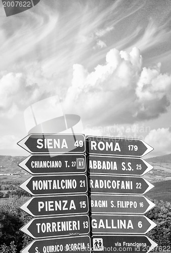 Image of Road signs pointing different directions in Tuscany