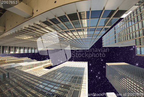 Image of Street level view of Tall Skyscrapers in Manhattan night - New Y