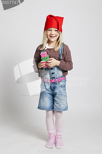 Image of Smiling happy girl holding Christmas presents