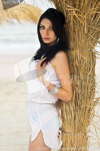 Image of Young brunette on a beach