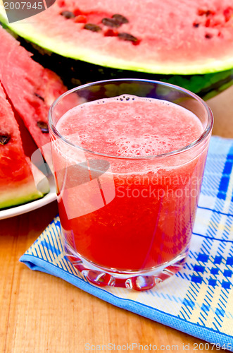 Image of Juice watermelon on a napkin and a board