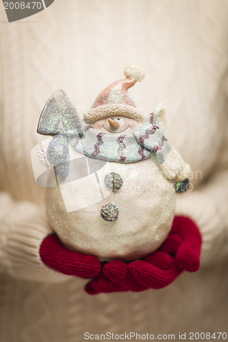Image of Woman Wearing Seasonal Red Mittens Holding Glass Snowman 