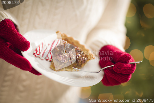 Image of Woman Wearing Red Mittens Holding Plate of Pecan Pie, Peppermint