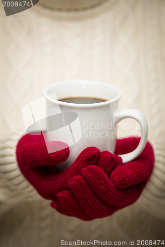 Image of Woman in Sweater with Red Mittens Holding Cup of Coffee