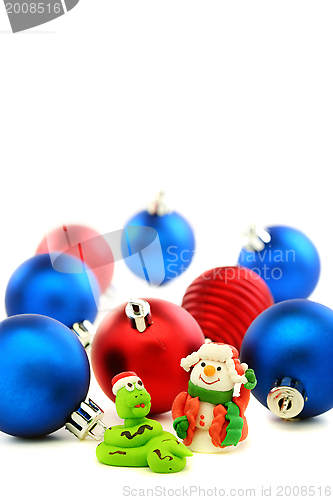 Image of Snake in the Santa hat and cheerful snowman.