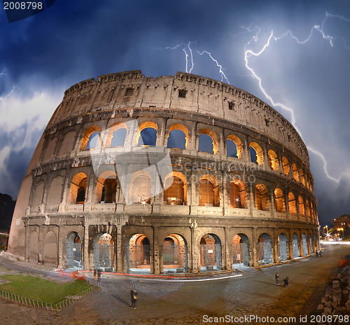 Image of Beautiful dramatic sky over Colosseum in Rome