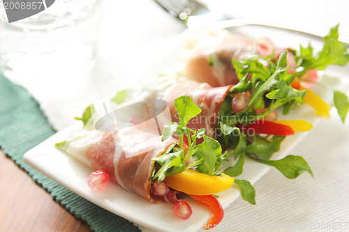 Image of Smoked ham with vegetables and pomegranate